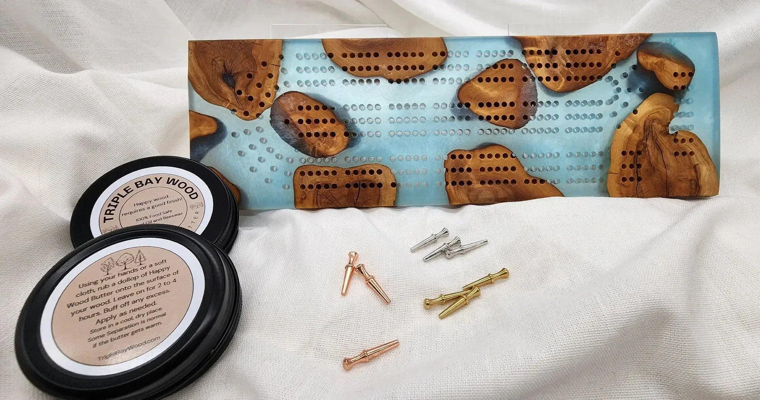 Wood and resin cribbage board with glossy finish detail