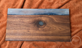 Dragon Eye premium dark walnut and smoky resin serving board, full front view