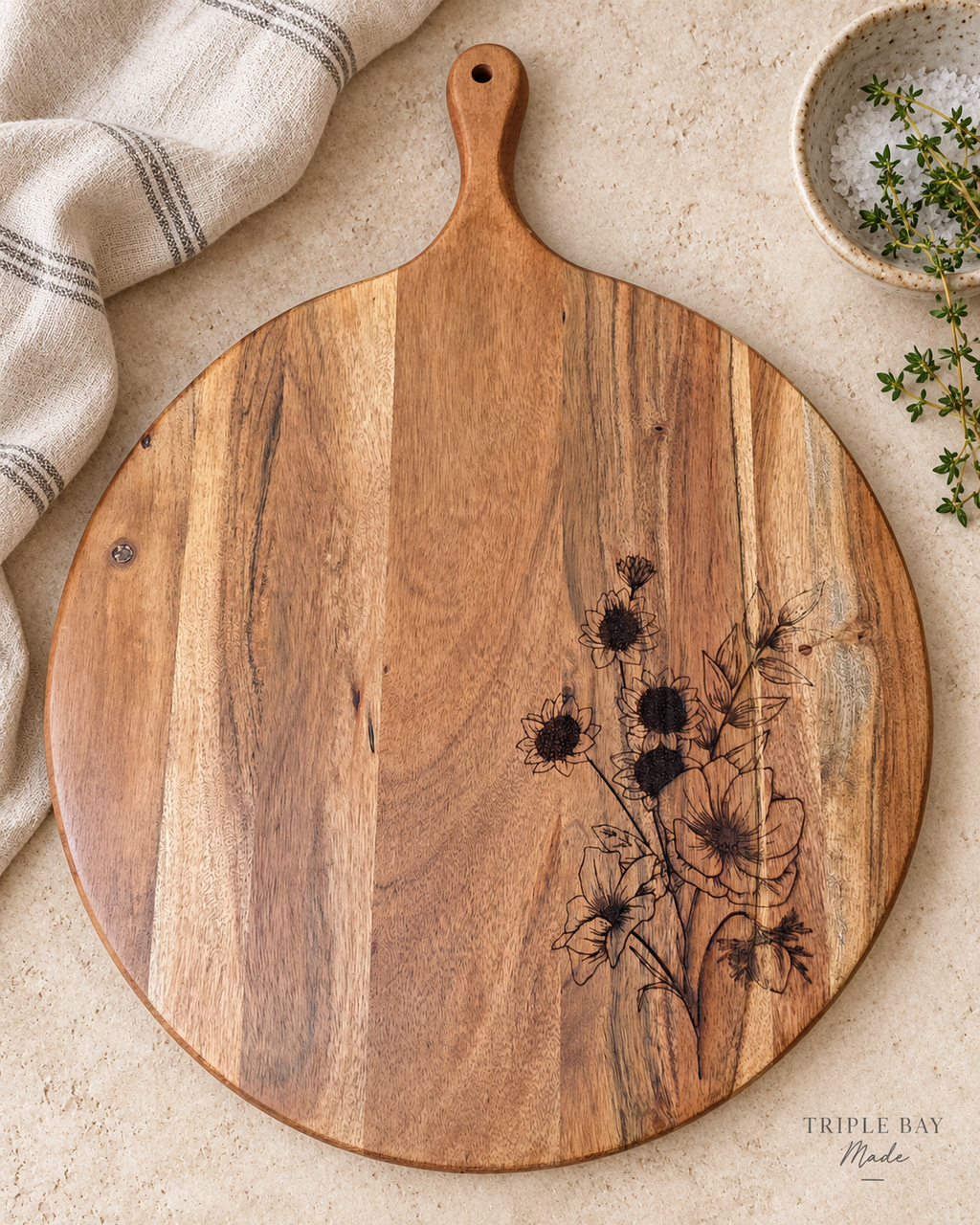 Wildflower Gather floral acacia board styled on a light stone counter