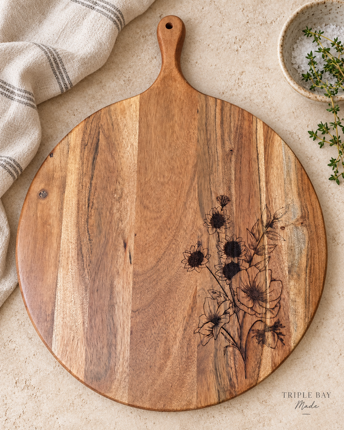 Wildflower Gather floral acacia board styled on a light stone counter