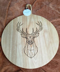 Large round rubberwood serving board engraved with a geometric stag