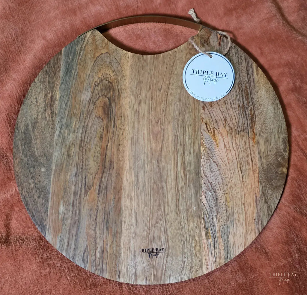 Back of Golden Birds acacia board with brass handle and maker mark
