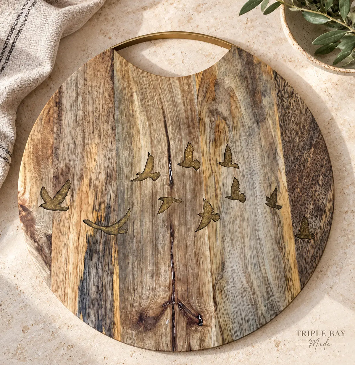 Golden Birds acacia board in a styled lifestyle visualization