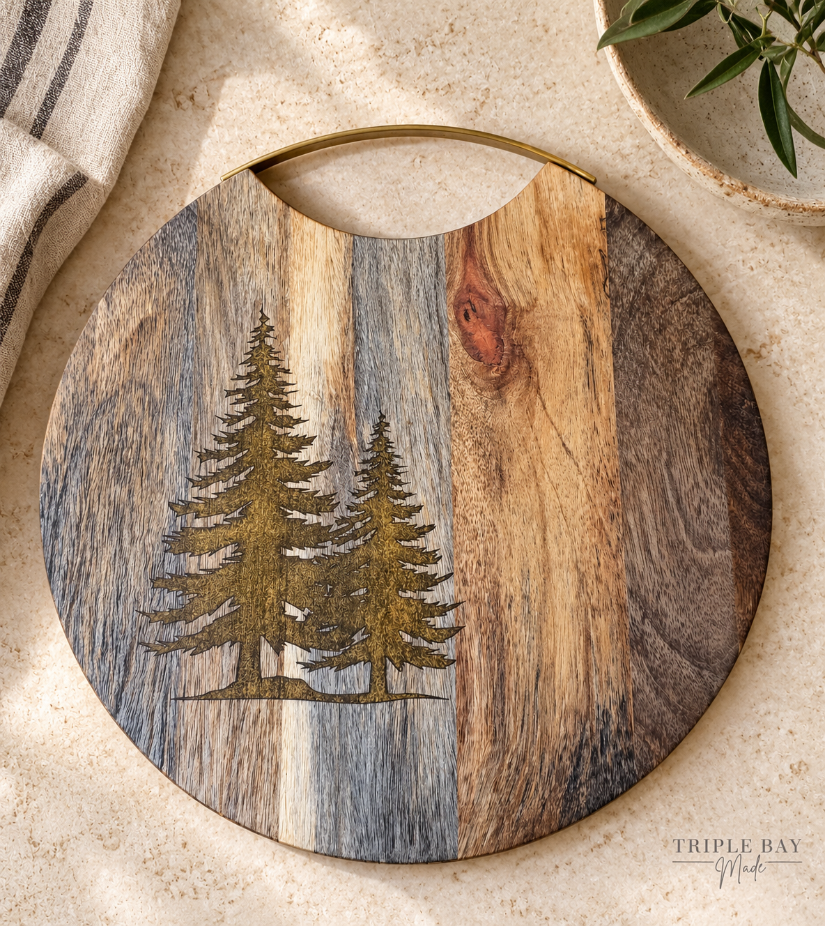 Golden Evergreens acacia board in a styled lifestyle visualization