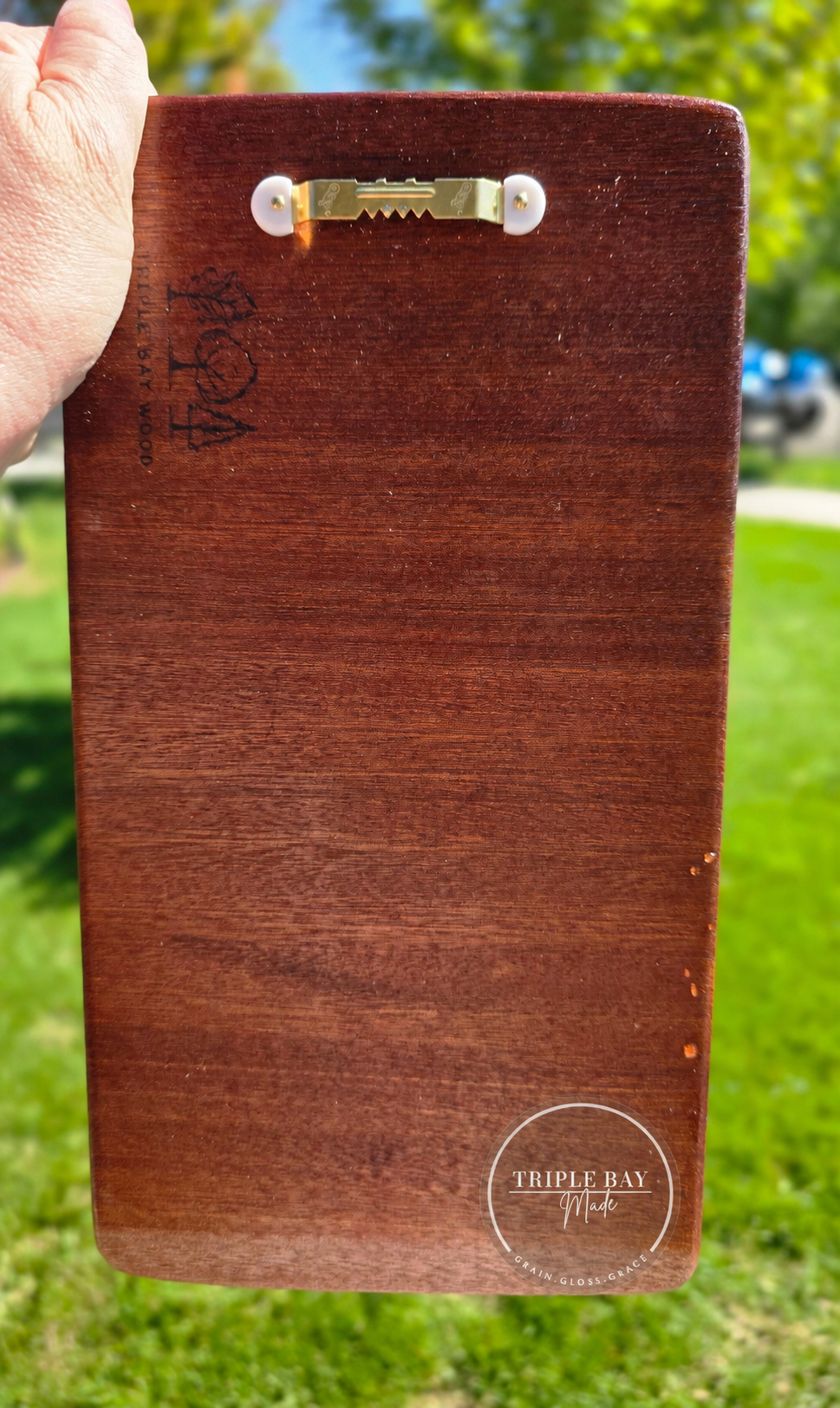 Back of bubinga propagation wall art showing installed sawtooth hanger