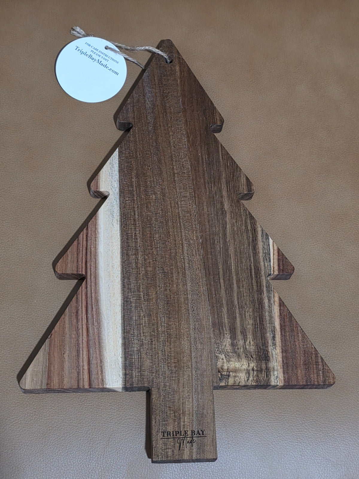 Original reverse of the acacia Christmas tree board showing natural grain and Triple Bay Made maker mark