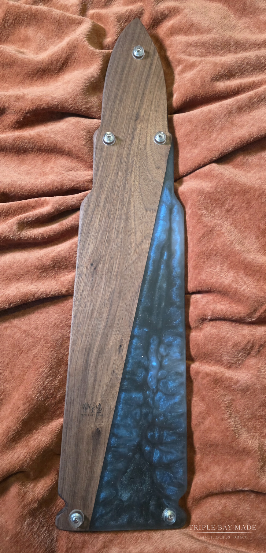 Underside of Midnight Current walnut resin serving board showing protective feet