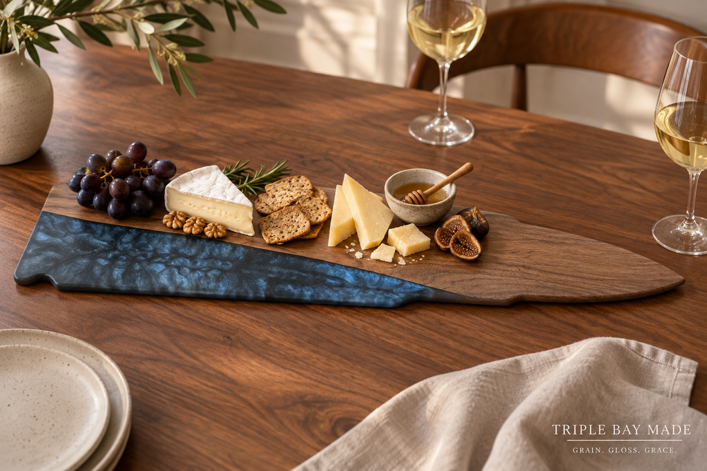 Midnight Current walnut resin board styled with cheese fruit and crackers