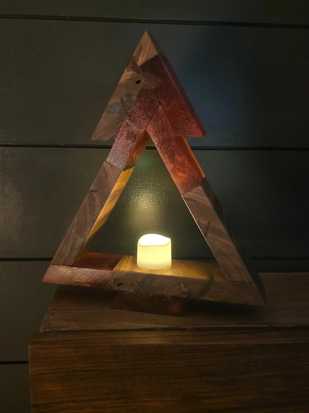 Premium walnut and red resin Christmas tree with included flickering tea light