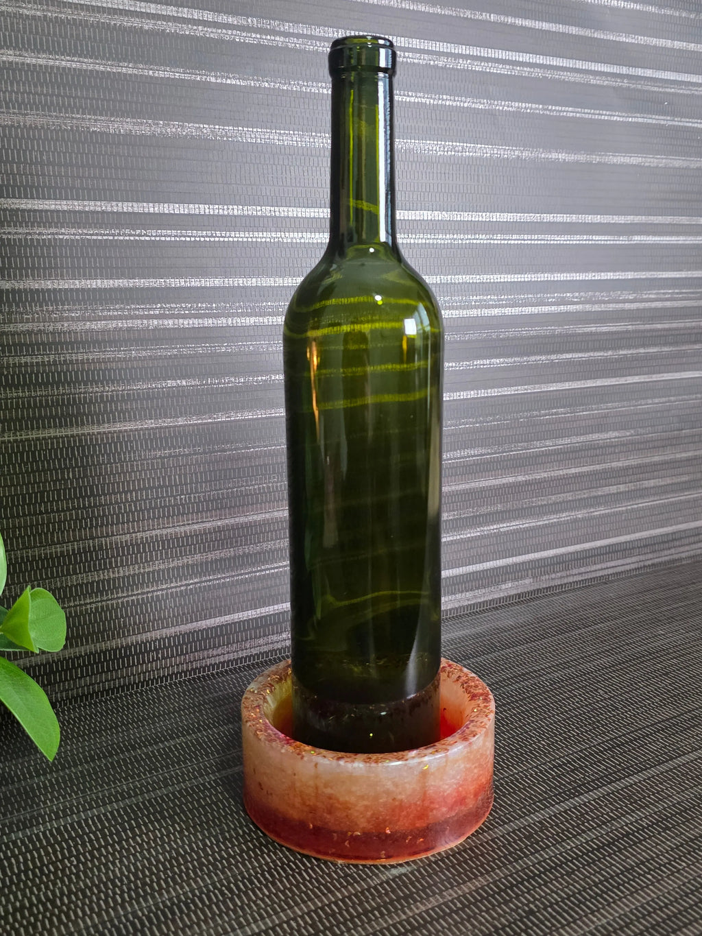 Wine bottle inside wine bottle coaster