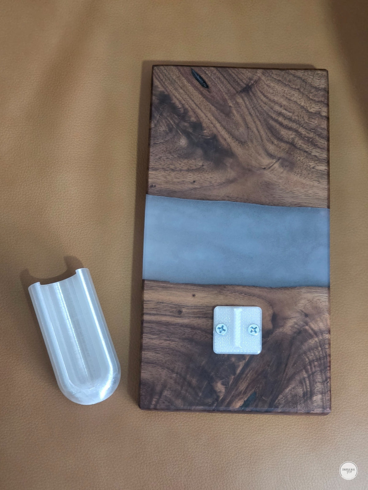 Removable 3D-printed glass tube cradle on the walnut and resin wall hanging