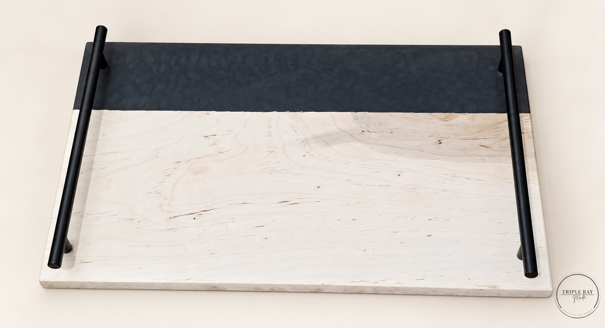 Maple serving tray with dark charcoal resin band and two long black handles, front view