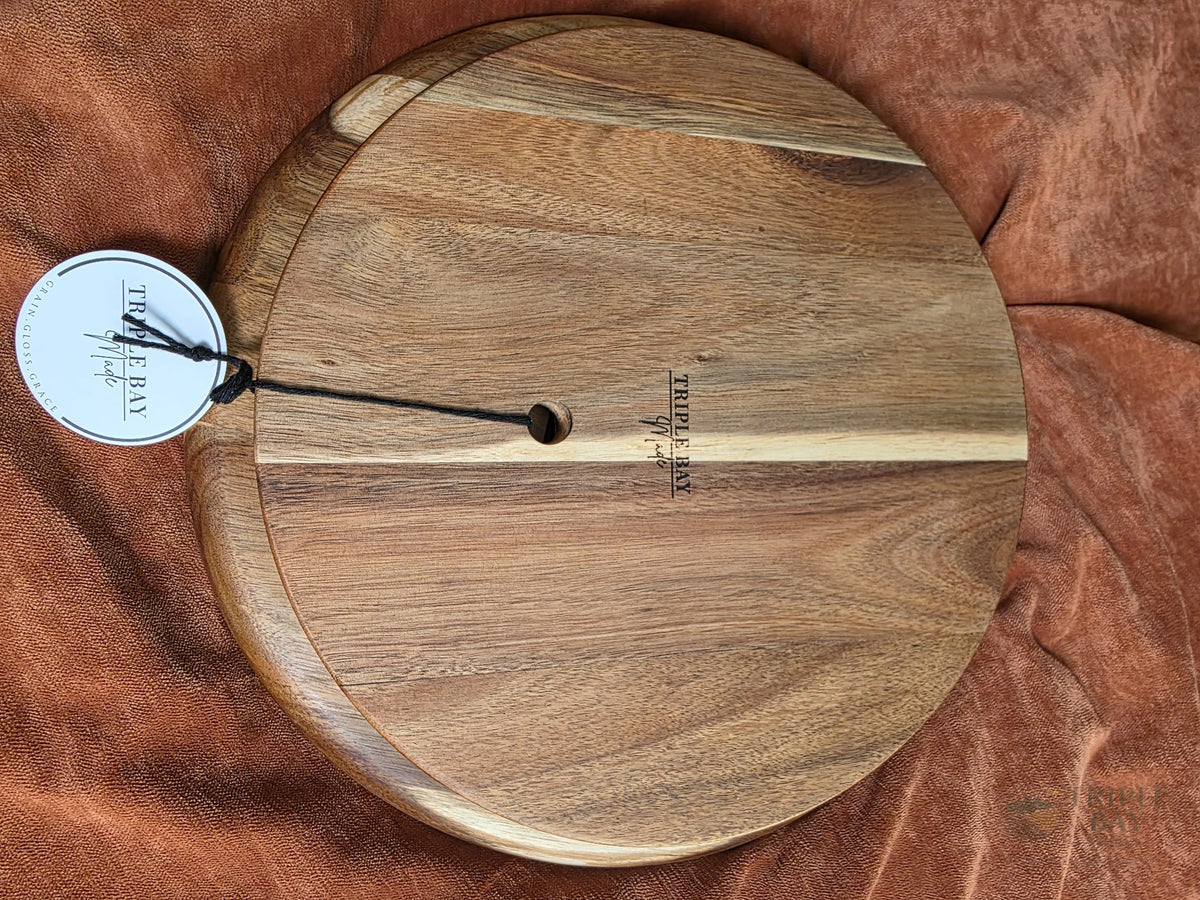 Back of acacia lazy Susan showing the rotating base and maker mark