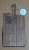 Front of acacia serving board with walnut finish and engraved pinecones and evergreen branches