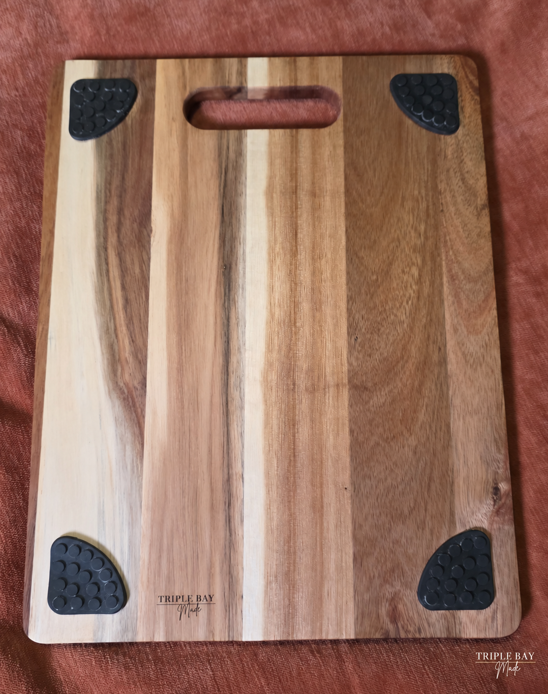 Back of Woodland Stag acacia board showing four feet and maker mark