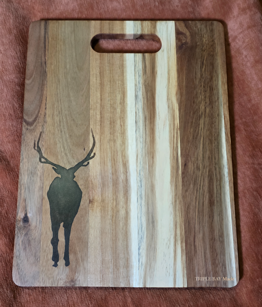Woodland Stag acacia cutting and serving board with dark resin inlay, front view